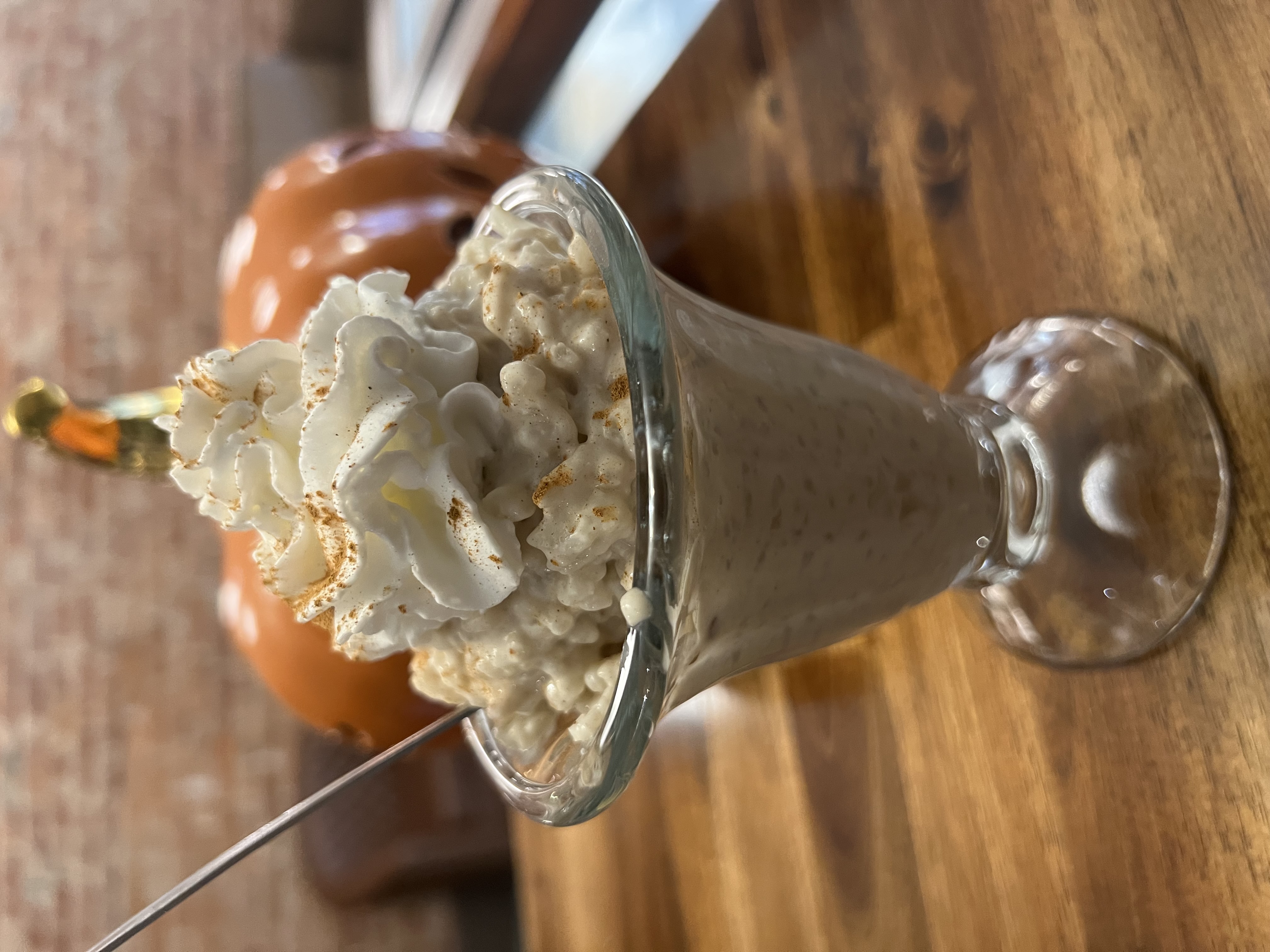 a dessert in a glass cup on a table