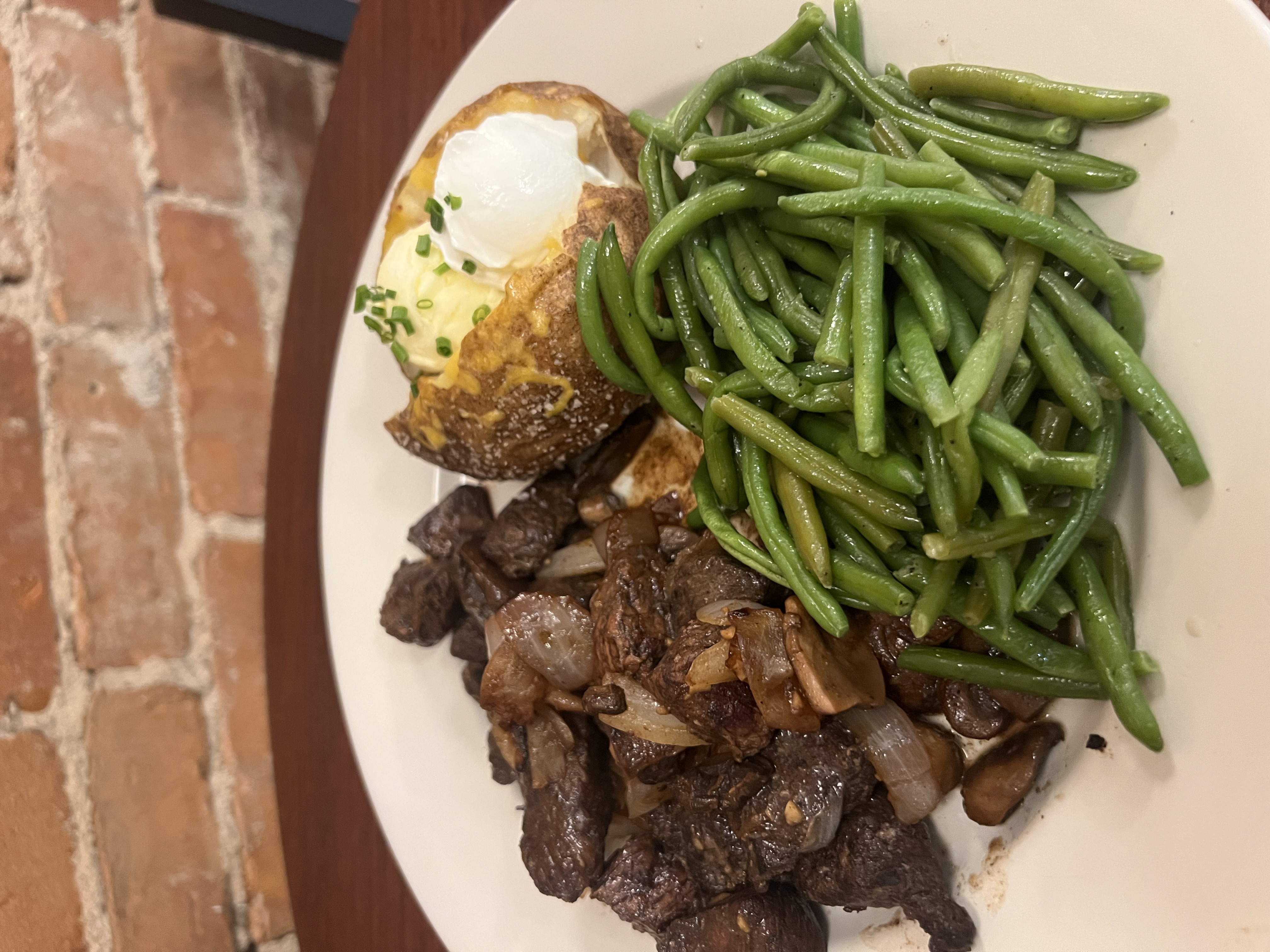 a plate of food with meat and vegetables