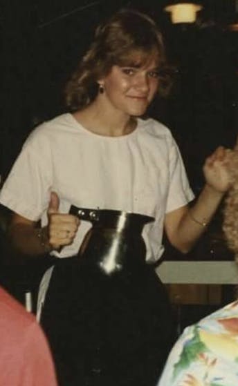 a person holding a cake