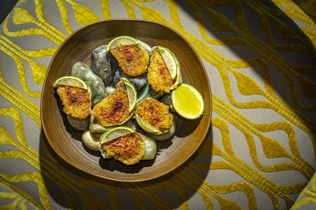 a plate full of food on a chartreusse table cover