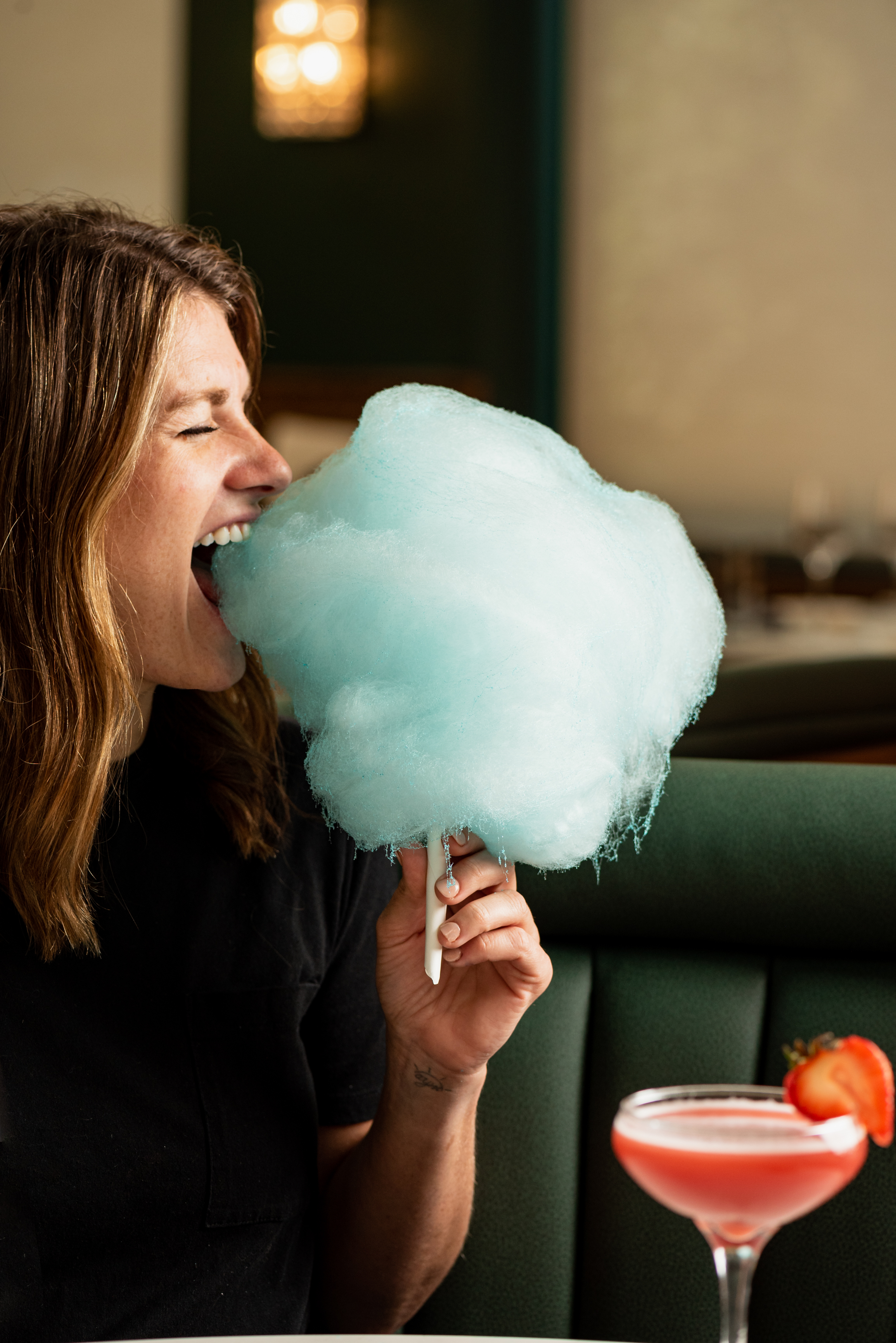 a woman eating a donut
