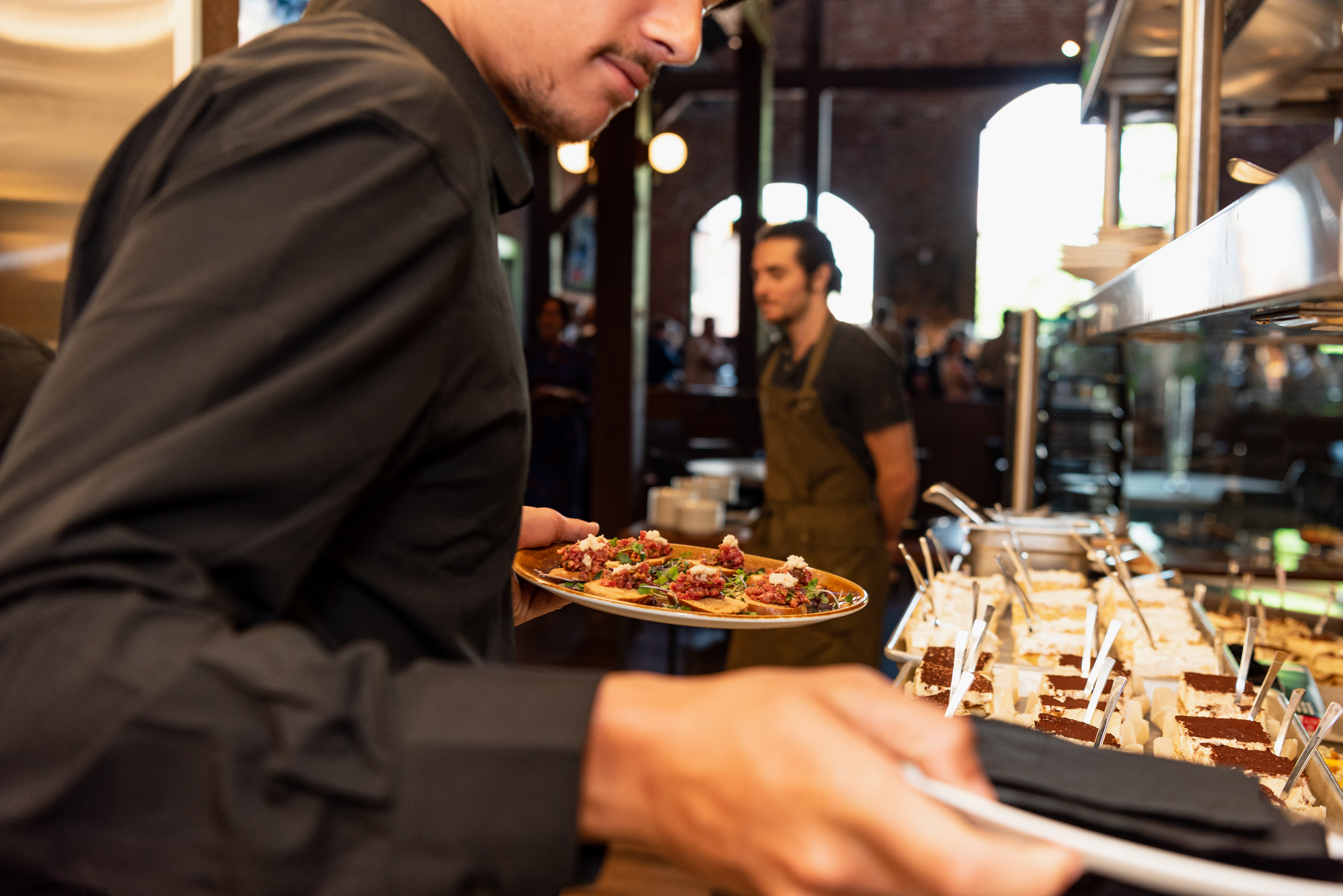 a man cooking pizza
