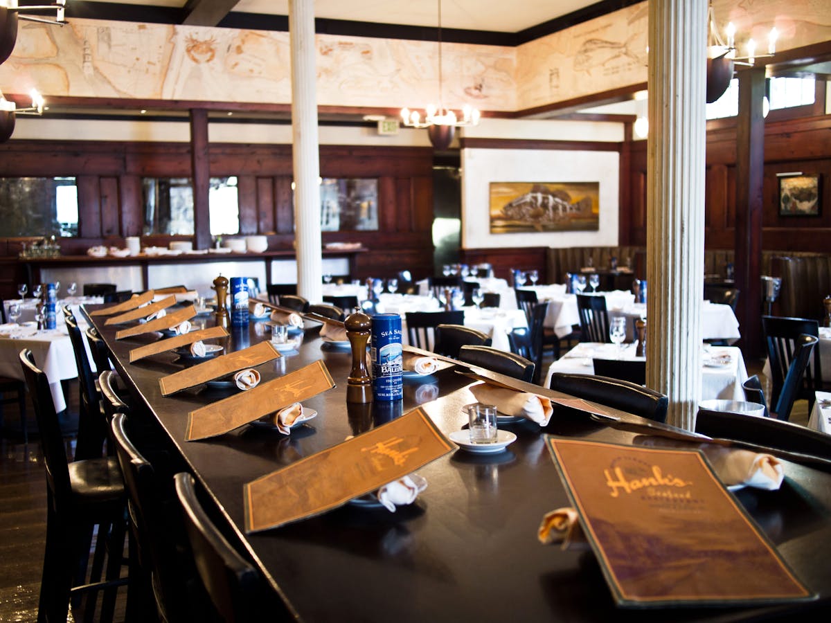 a kitchen with a table in a restaurant