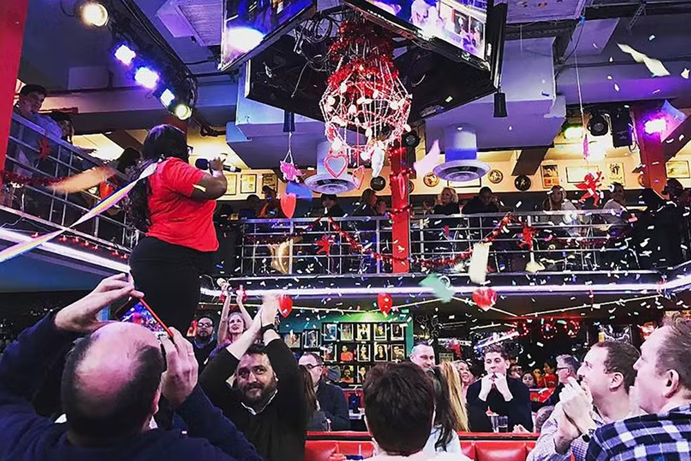 a group of people on a stage in front of a crowd