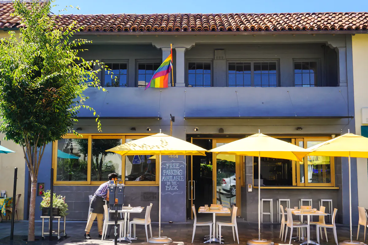 a yellow umbrella in front of a building