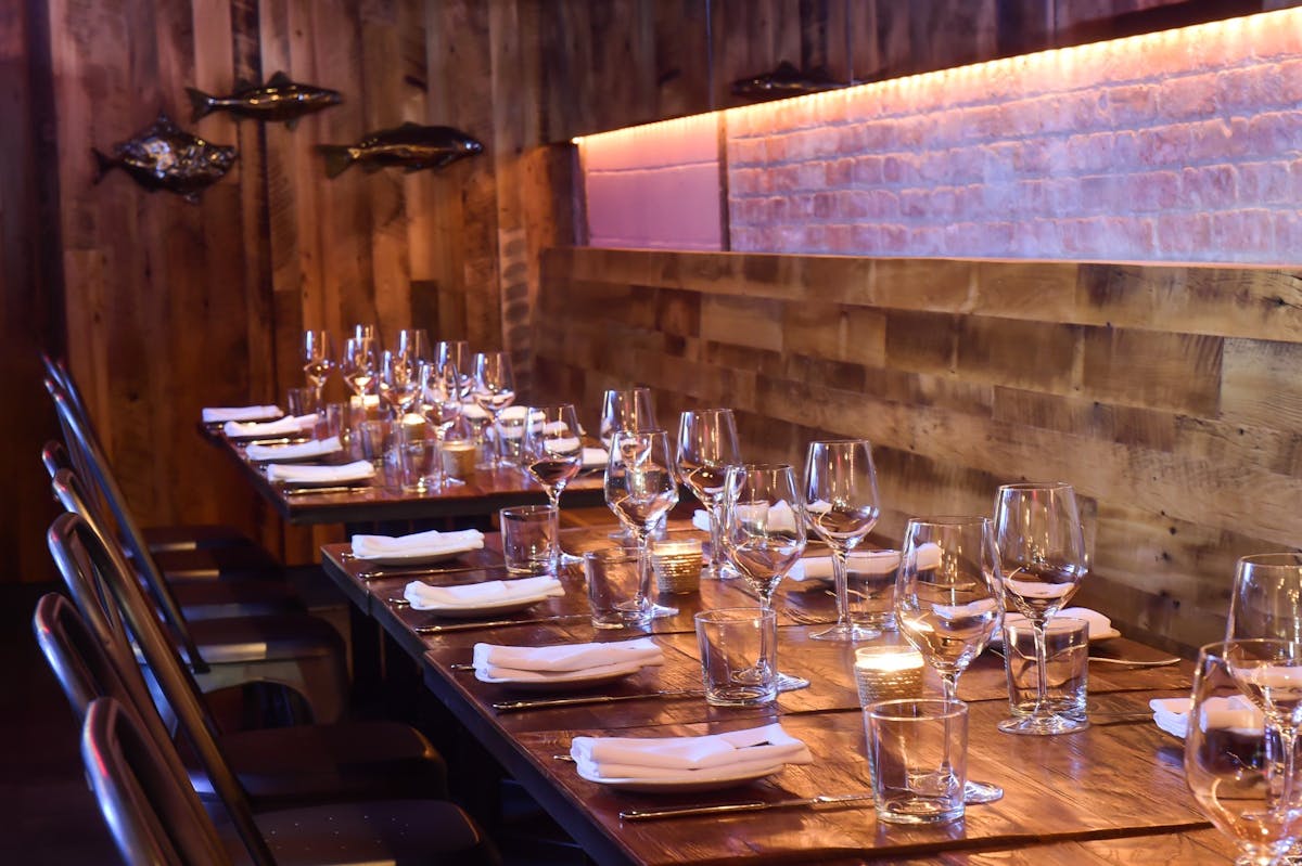 a dining table filled with wine glasses