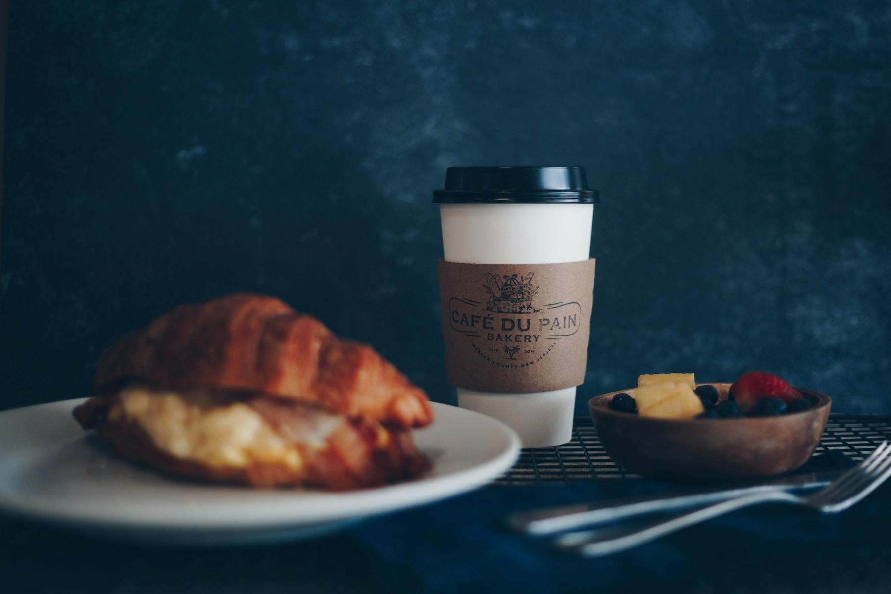 a plate of food and a cup of coffee