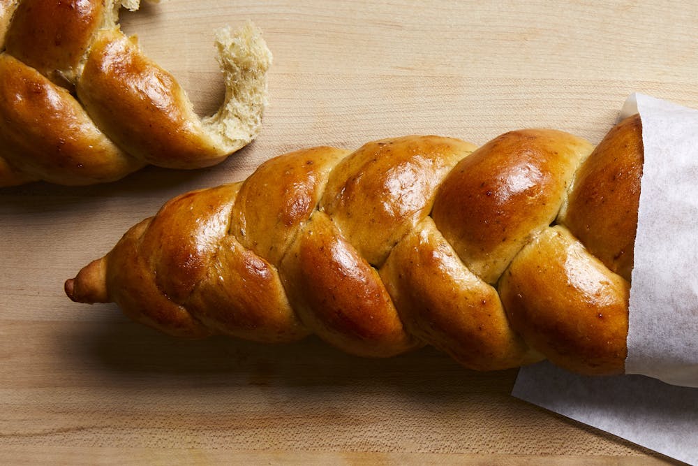 a sandwich sitting on top of a wooden table