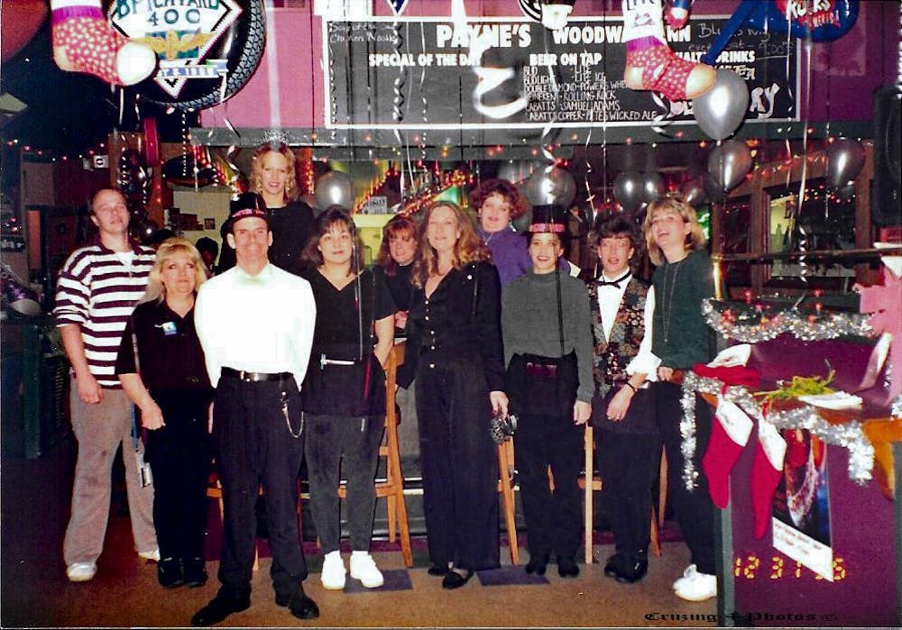 a group of people standing in front of a crowd posing for the camera