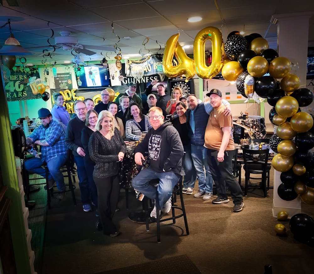 a group of people standing in front of a store