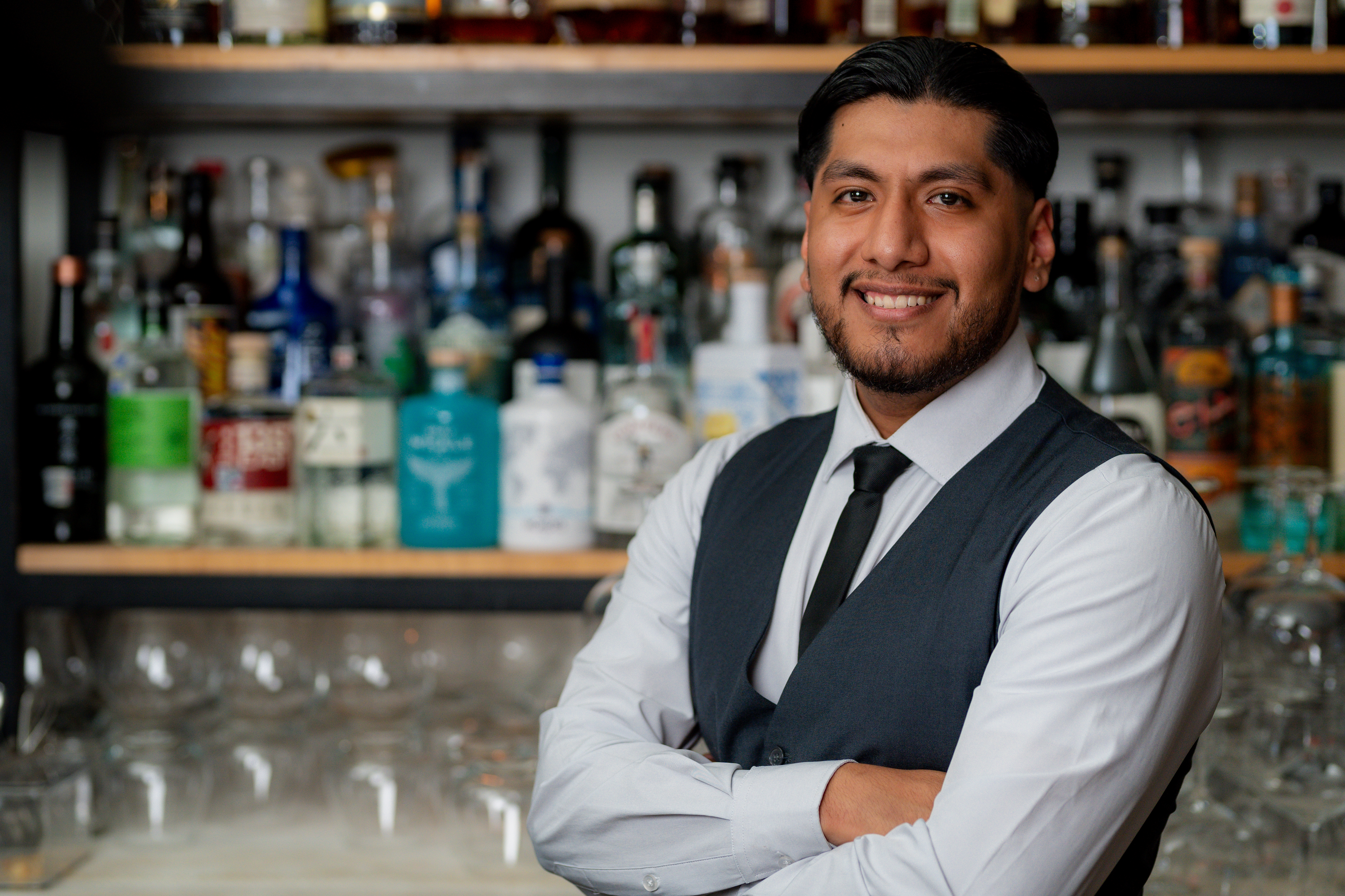 a man holding a bottle of wine