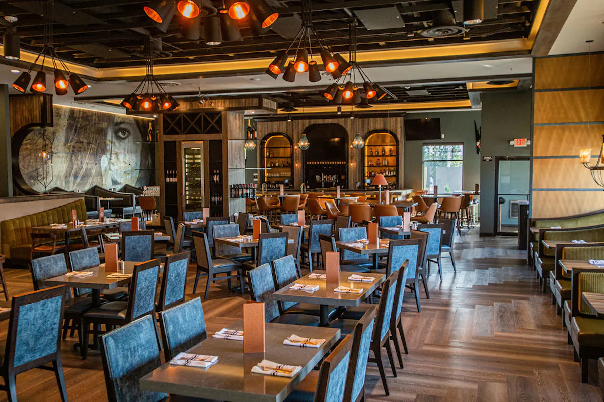 a room filled with furniture and a table in a restaurant