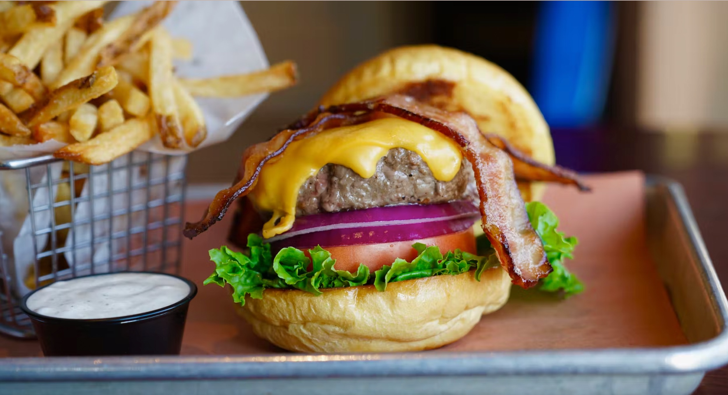 a close up of a sandwich and fries on a plate