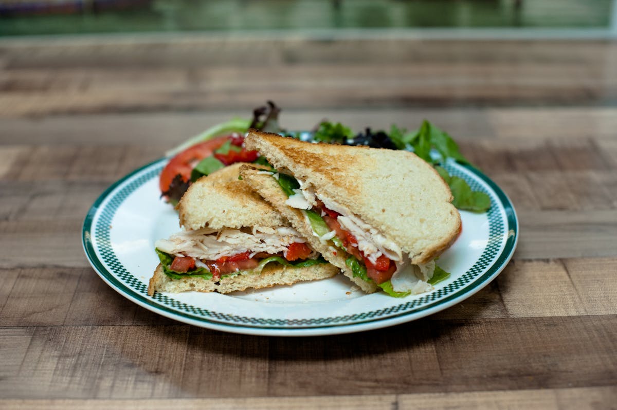 a sandwich cut in half on a plate