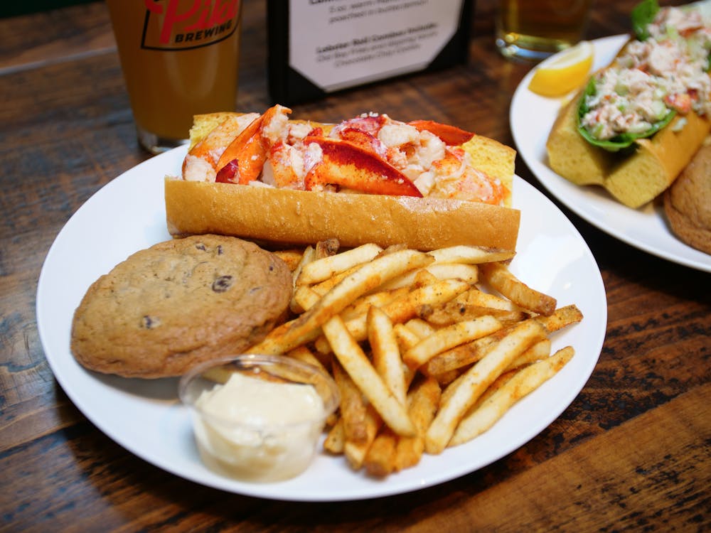 a plate with a sandwich and fries on a table