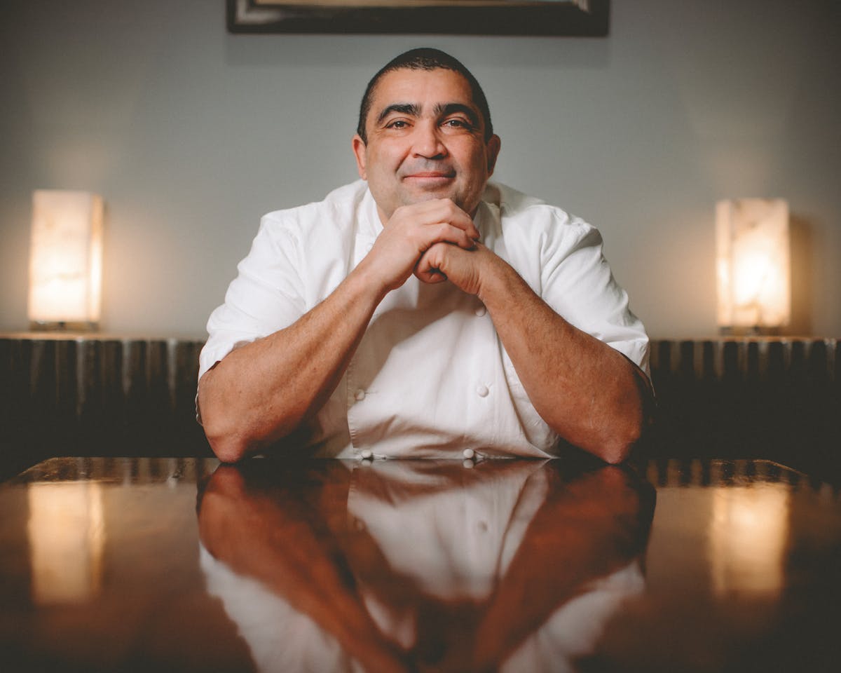 chef bryan sitting at a table