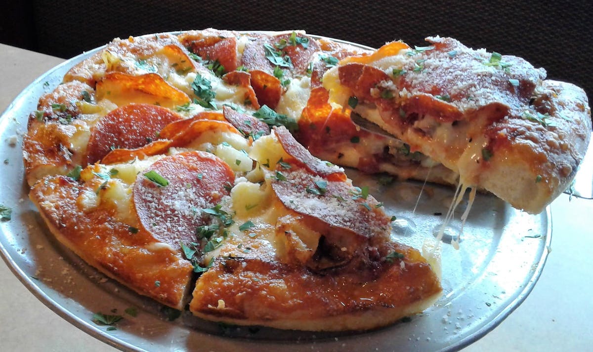 a slice of pizza on a plate