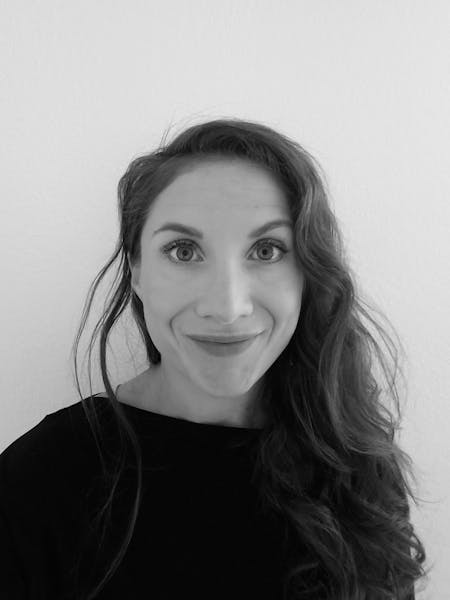 a woman who is smiling and looking at the camera