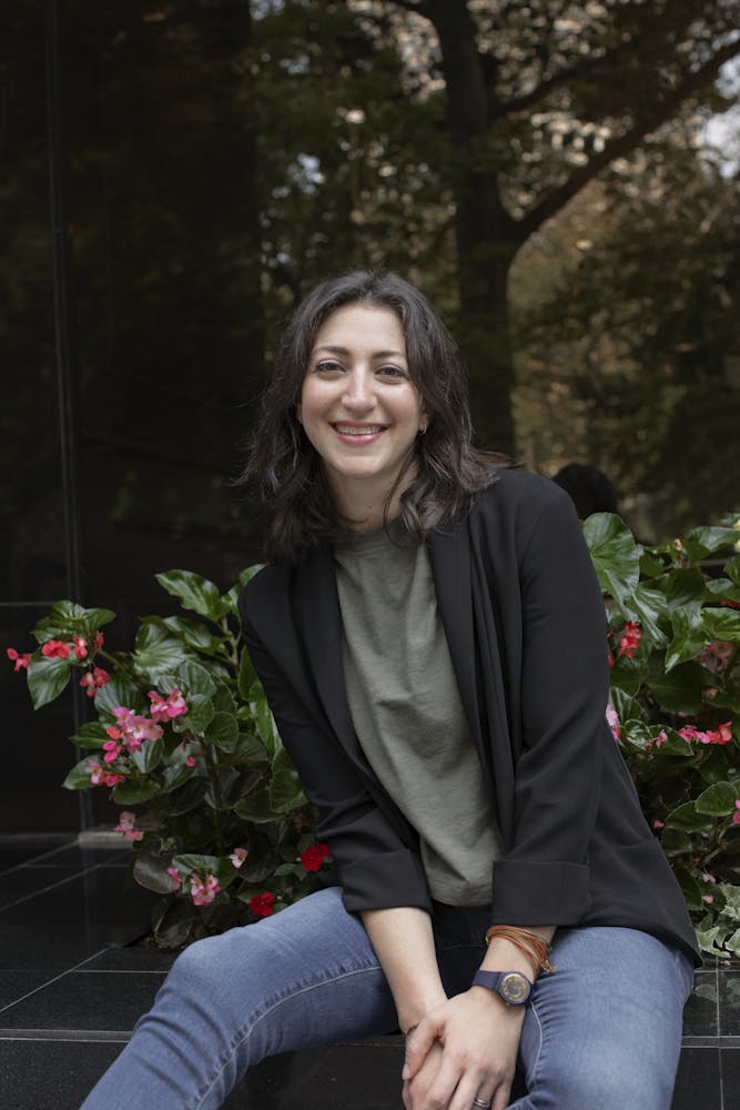 a woman sitting on a bench