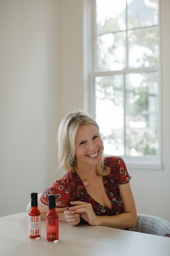 Molly Fienning sitting at a table in front of a window