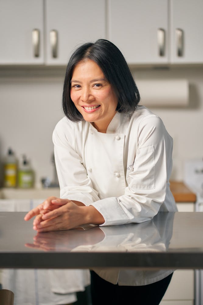 a woman standing in a kitchen