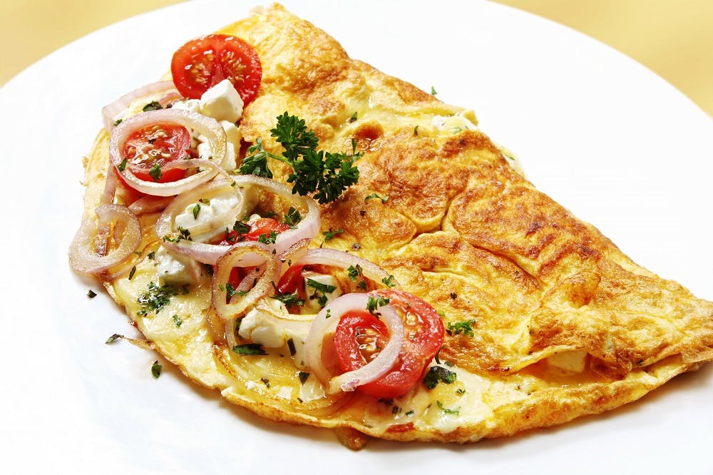 a slice of pizza on a plate