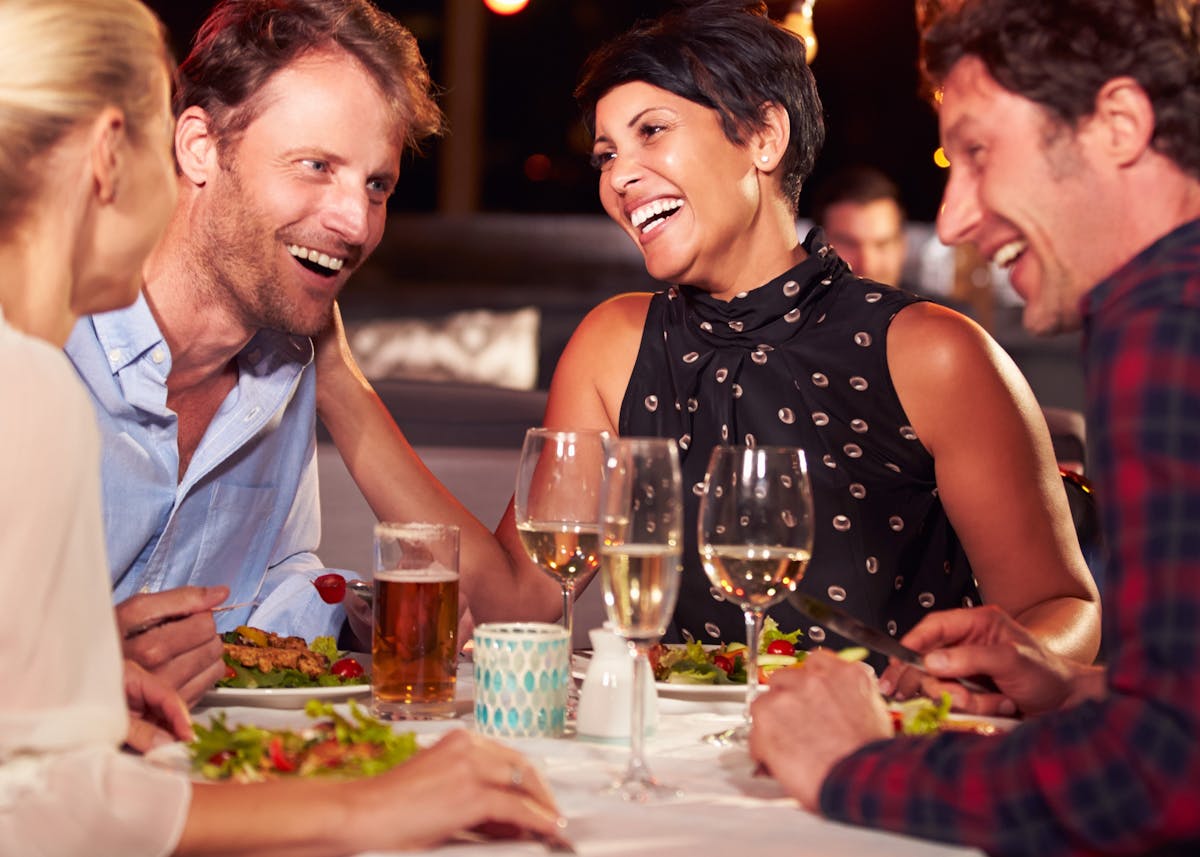a group of people sitting at a table