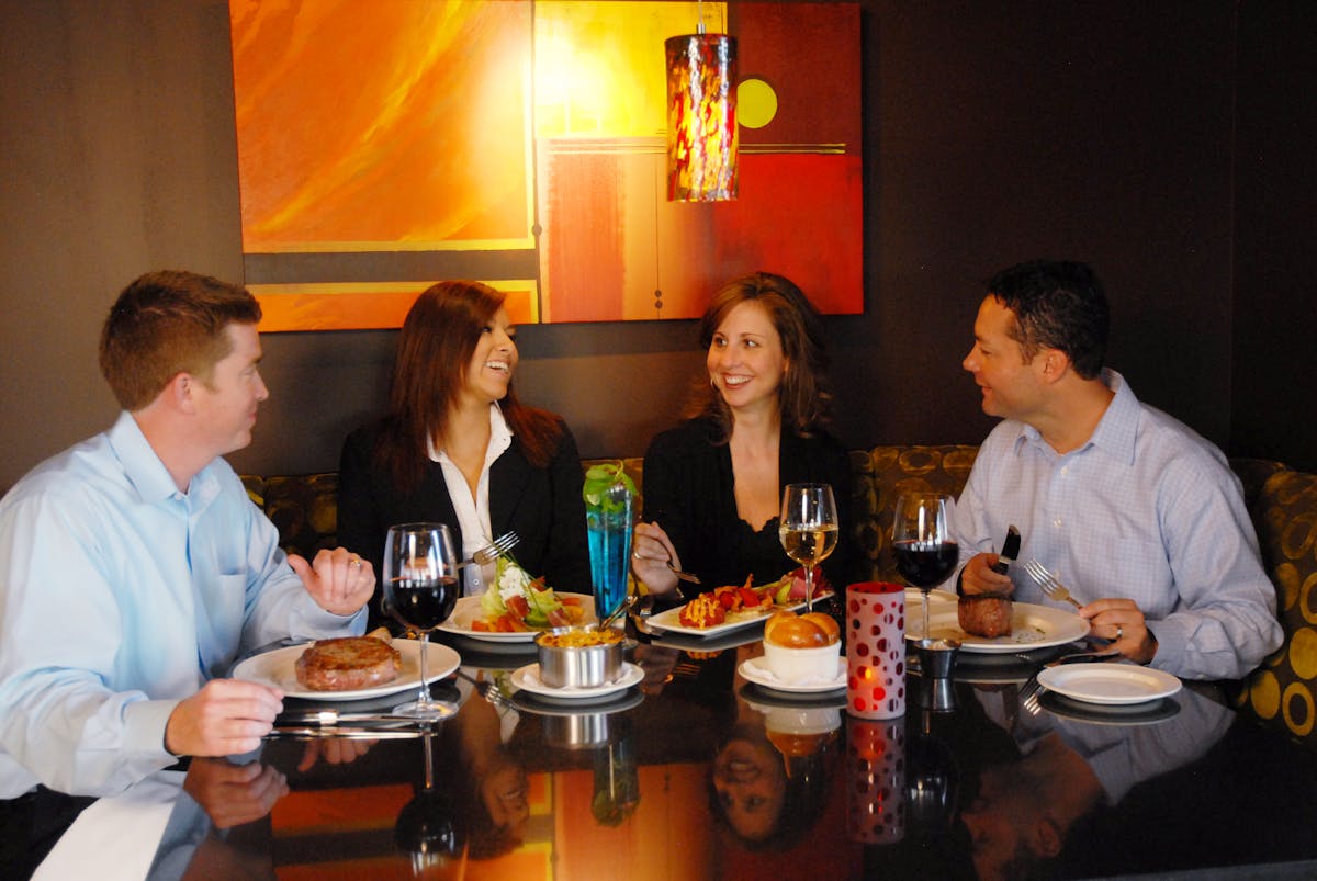 a group of people sitting at a table