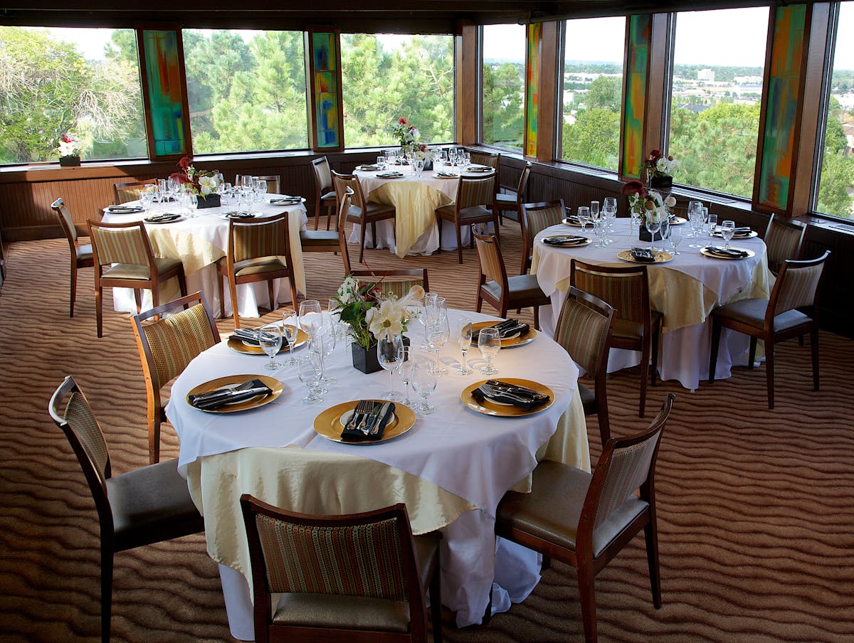 a dining room table in front of a window