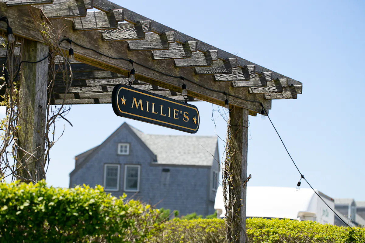 a house that has a sign on the side of a building