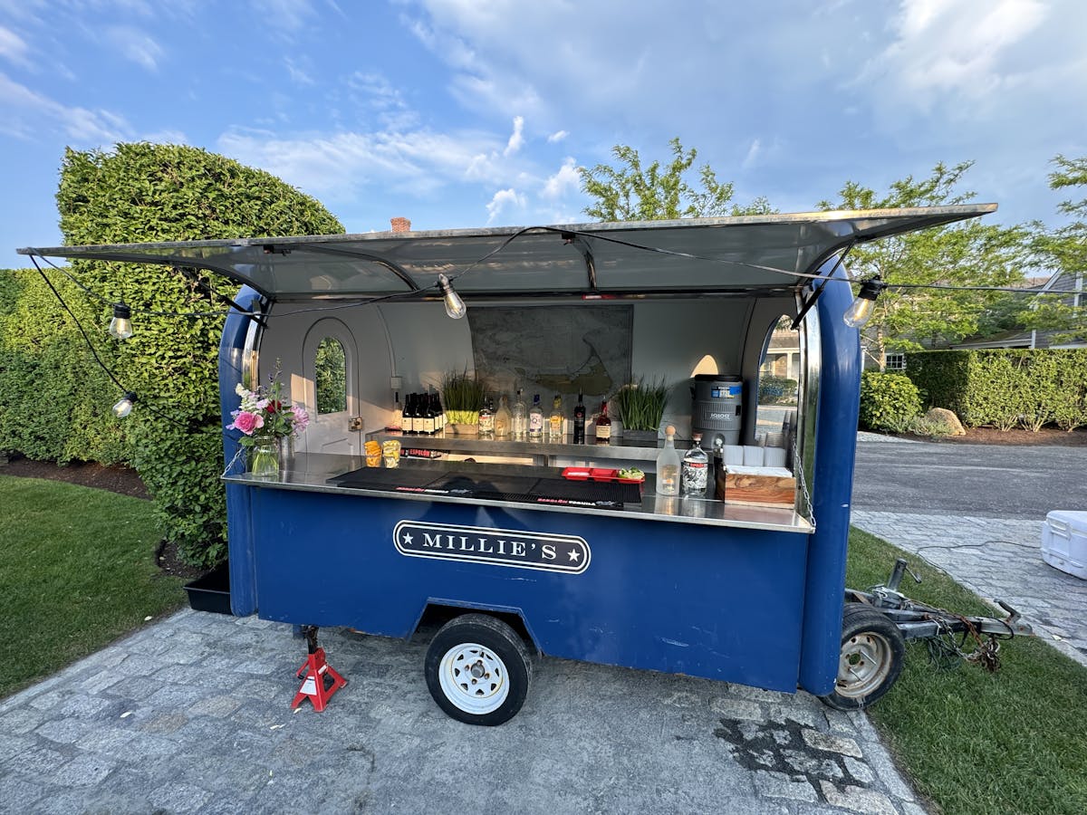 a truck is parked in front of a blue wall