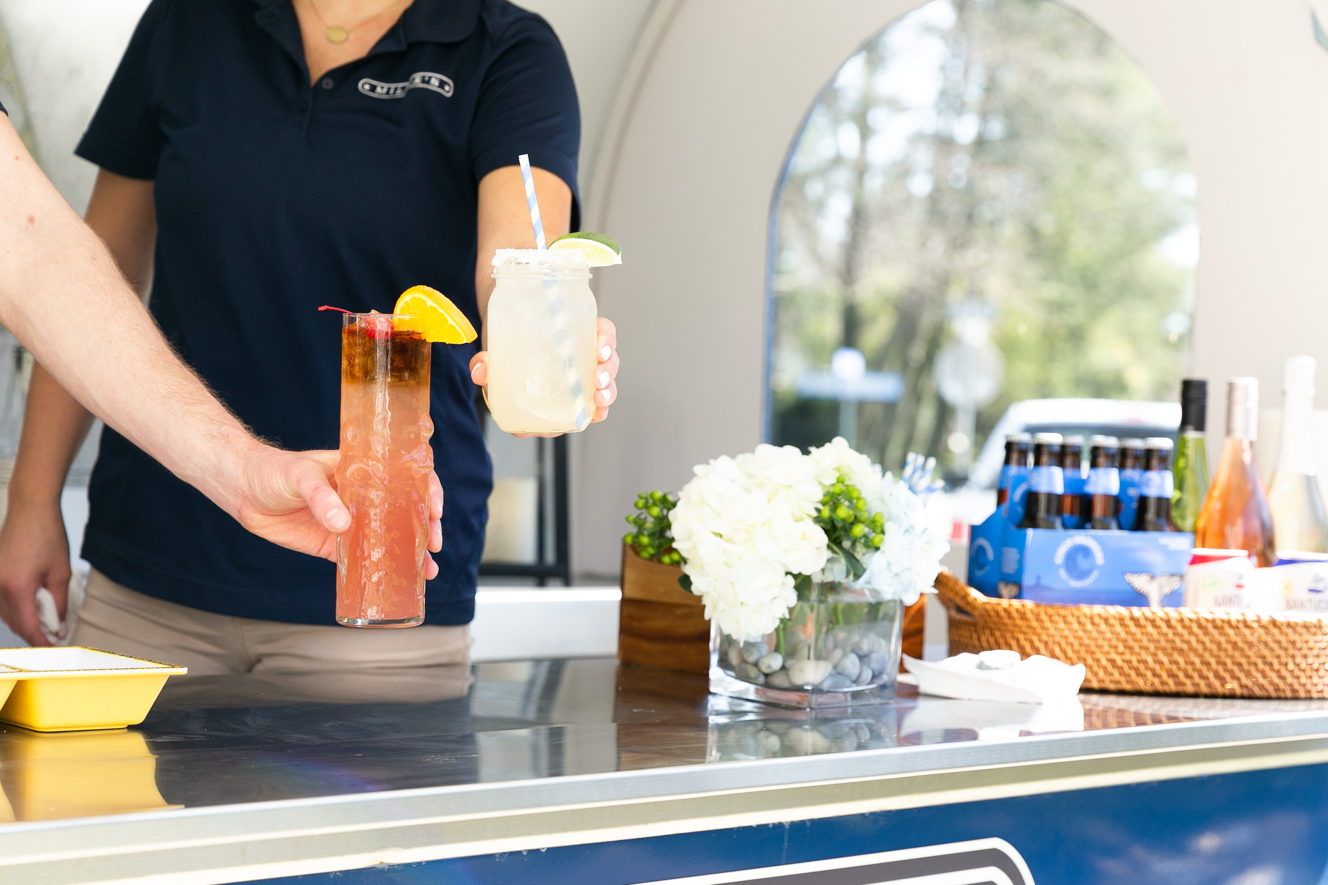 a person sitting at a table with a cake