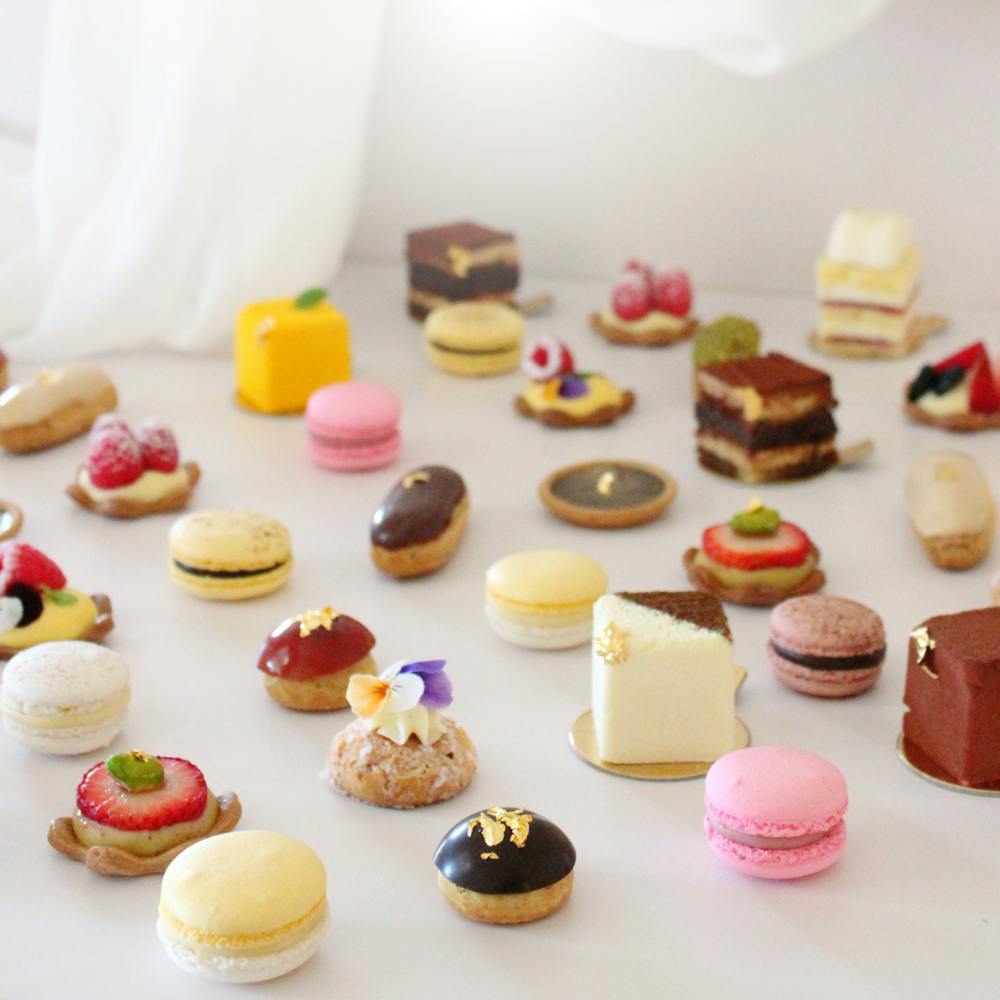a plate of food with a slice of cake on a table