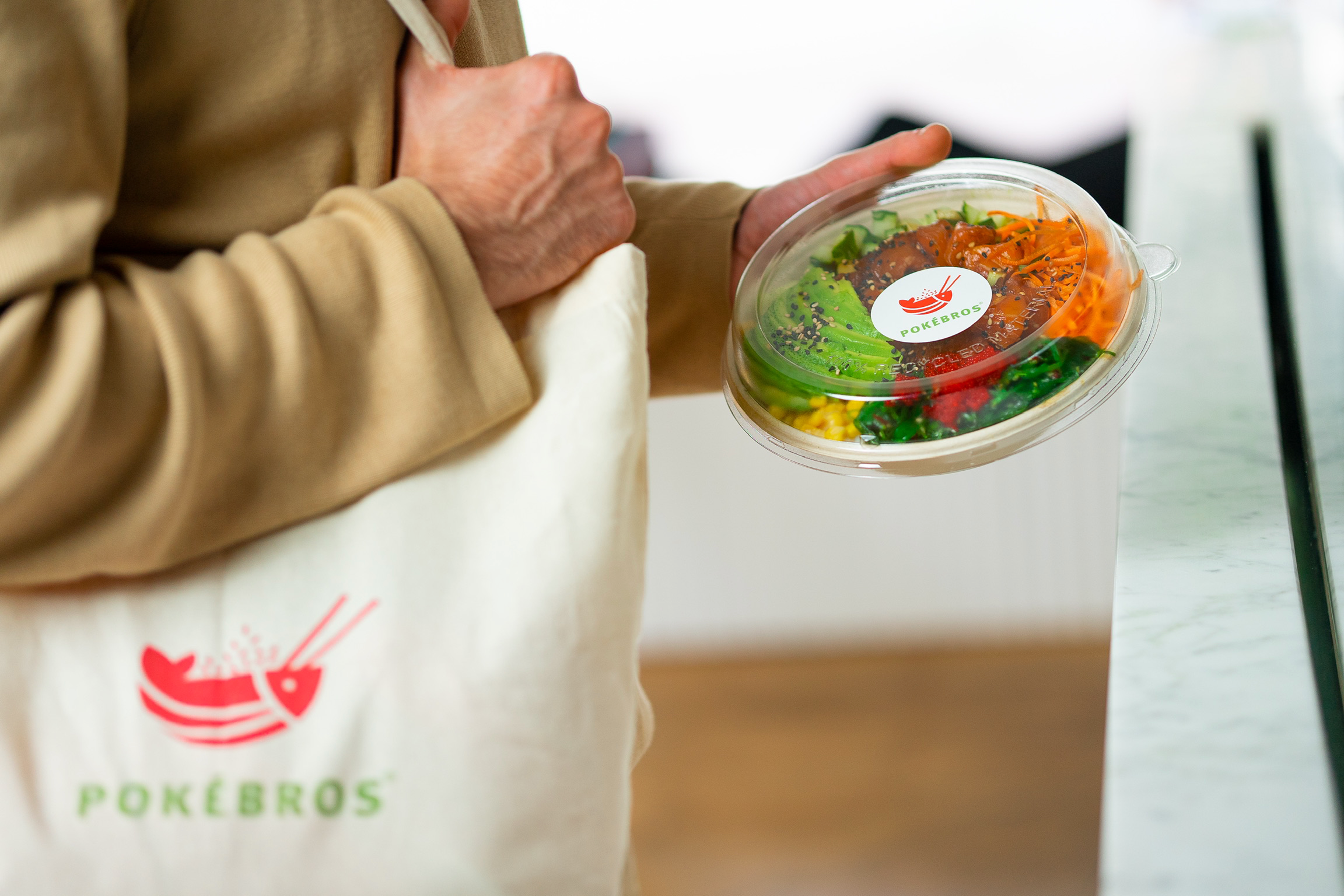 a person holding a bowl of food