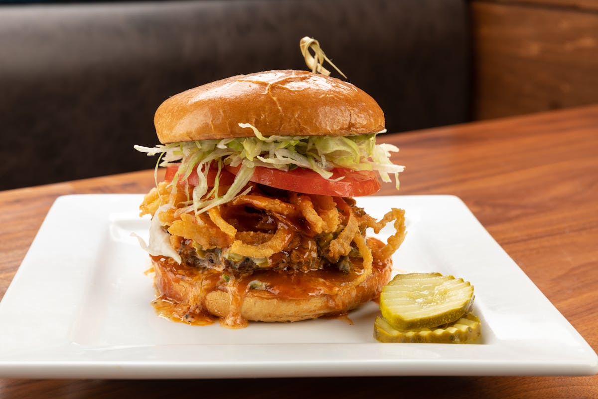 a sandwich sitting on top of a wooden table