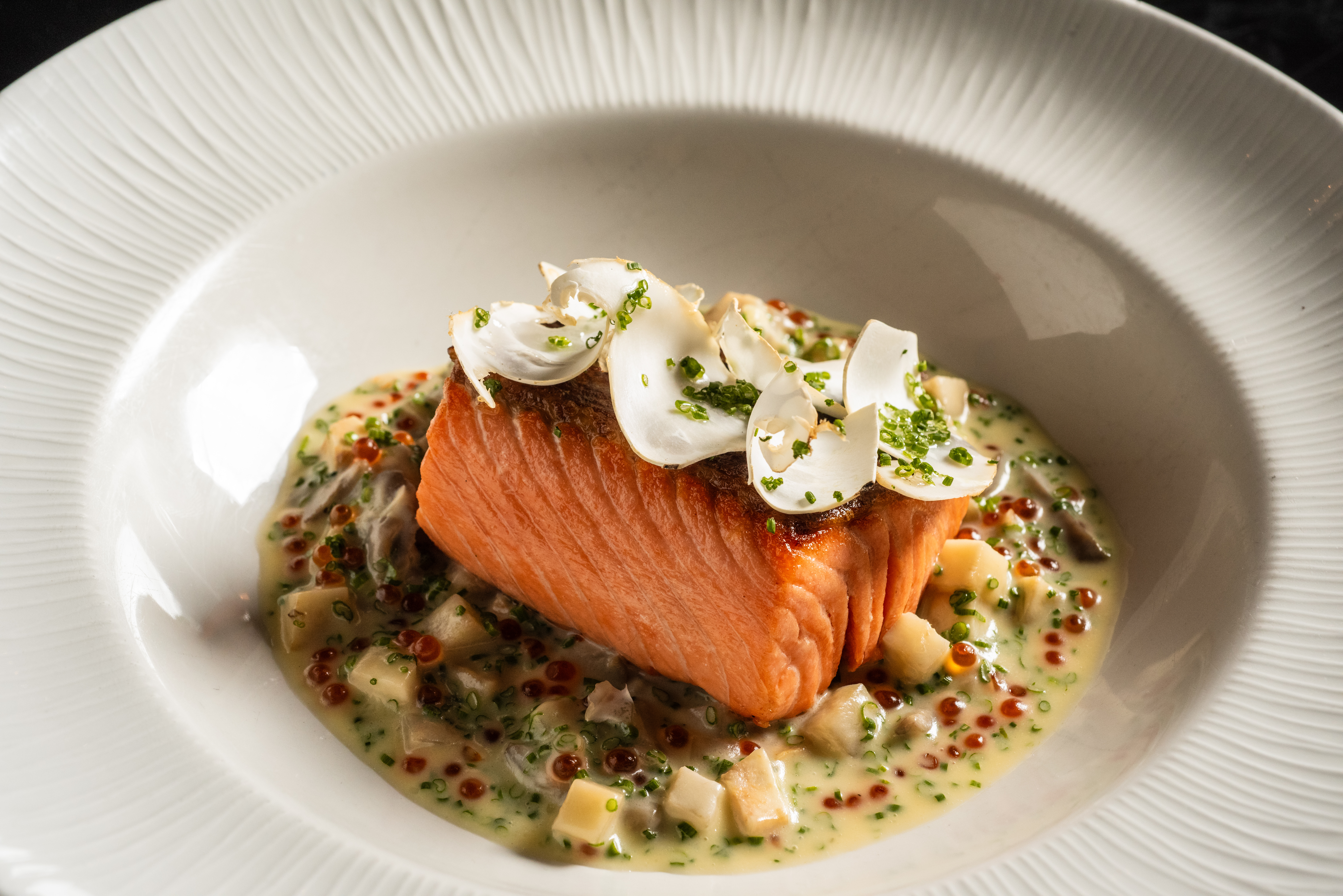 Salmon entree in a colorful sauce 