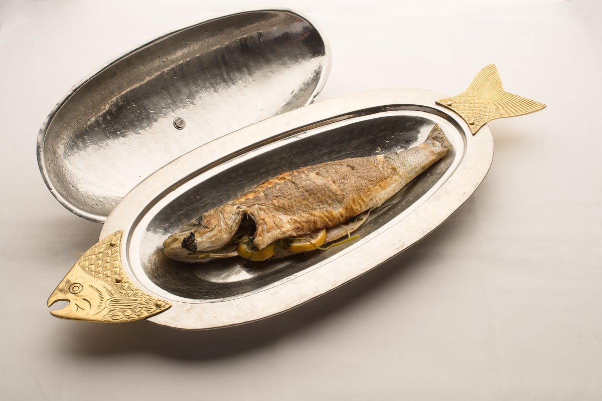 a plate with a whole fish