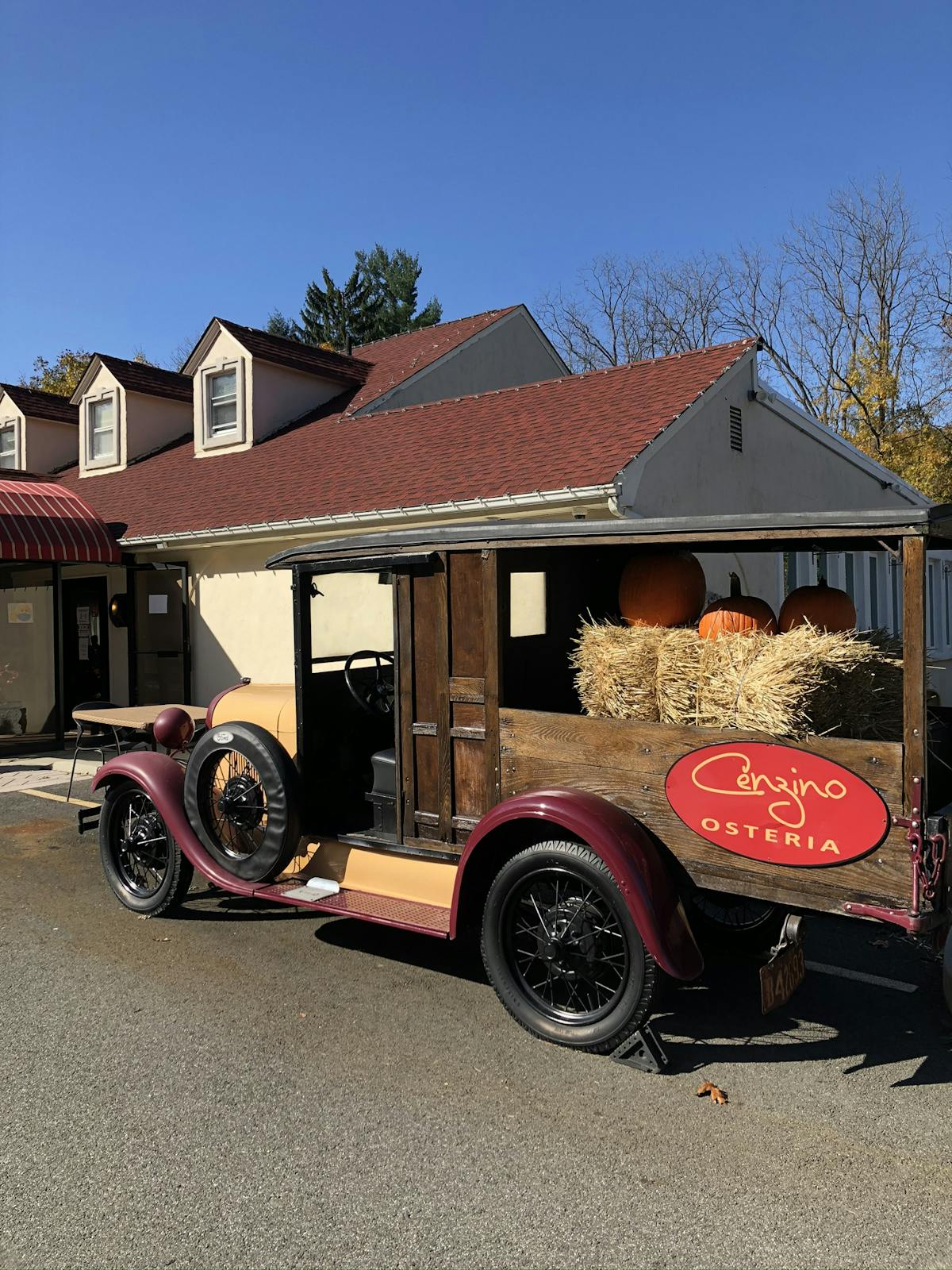 a truck is parked in front of the restaurant