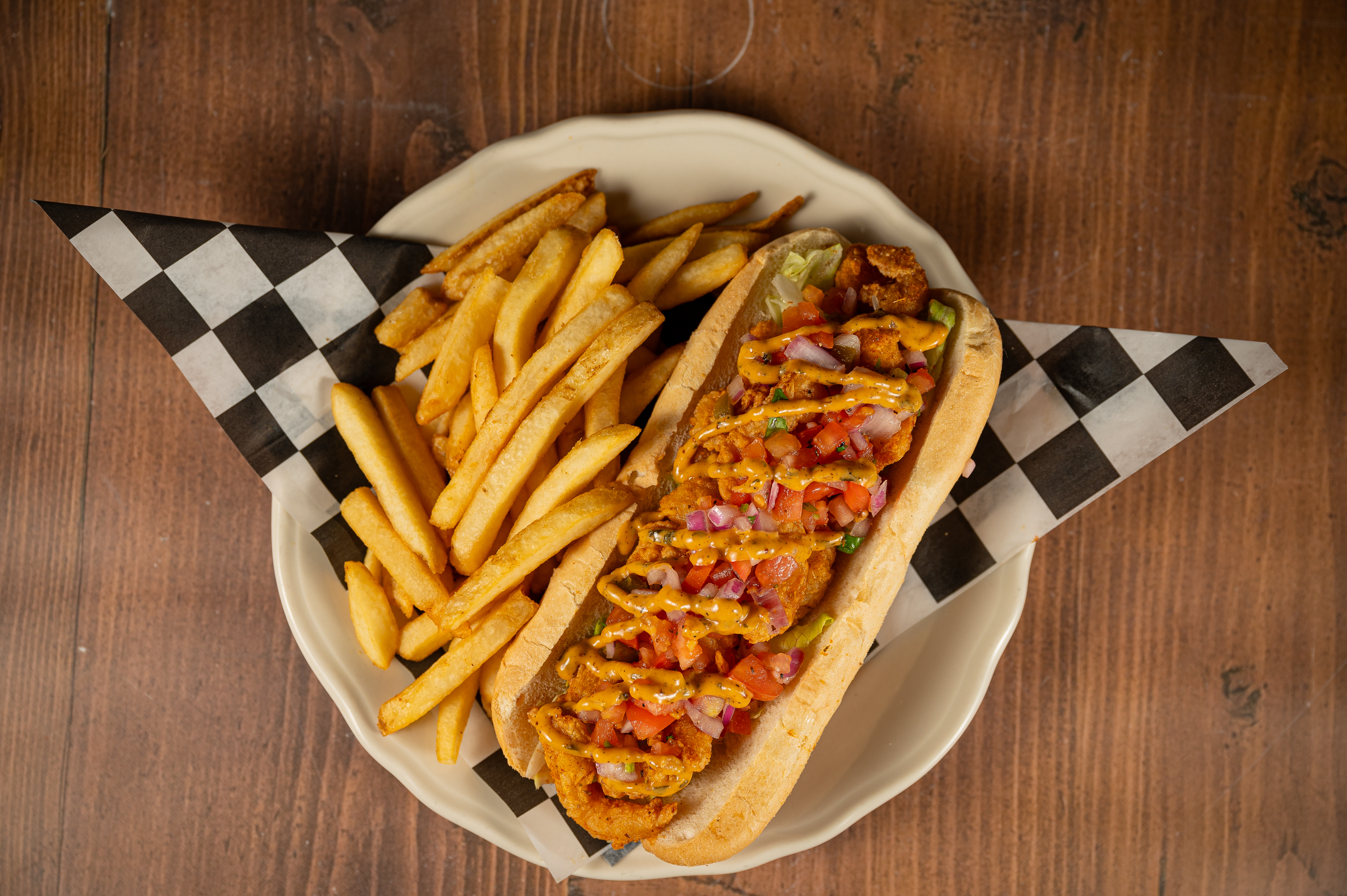 a plate of hot dogs sitting on top of a wooden table