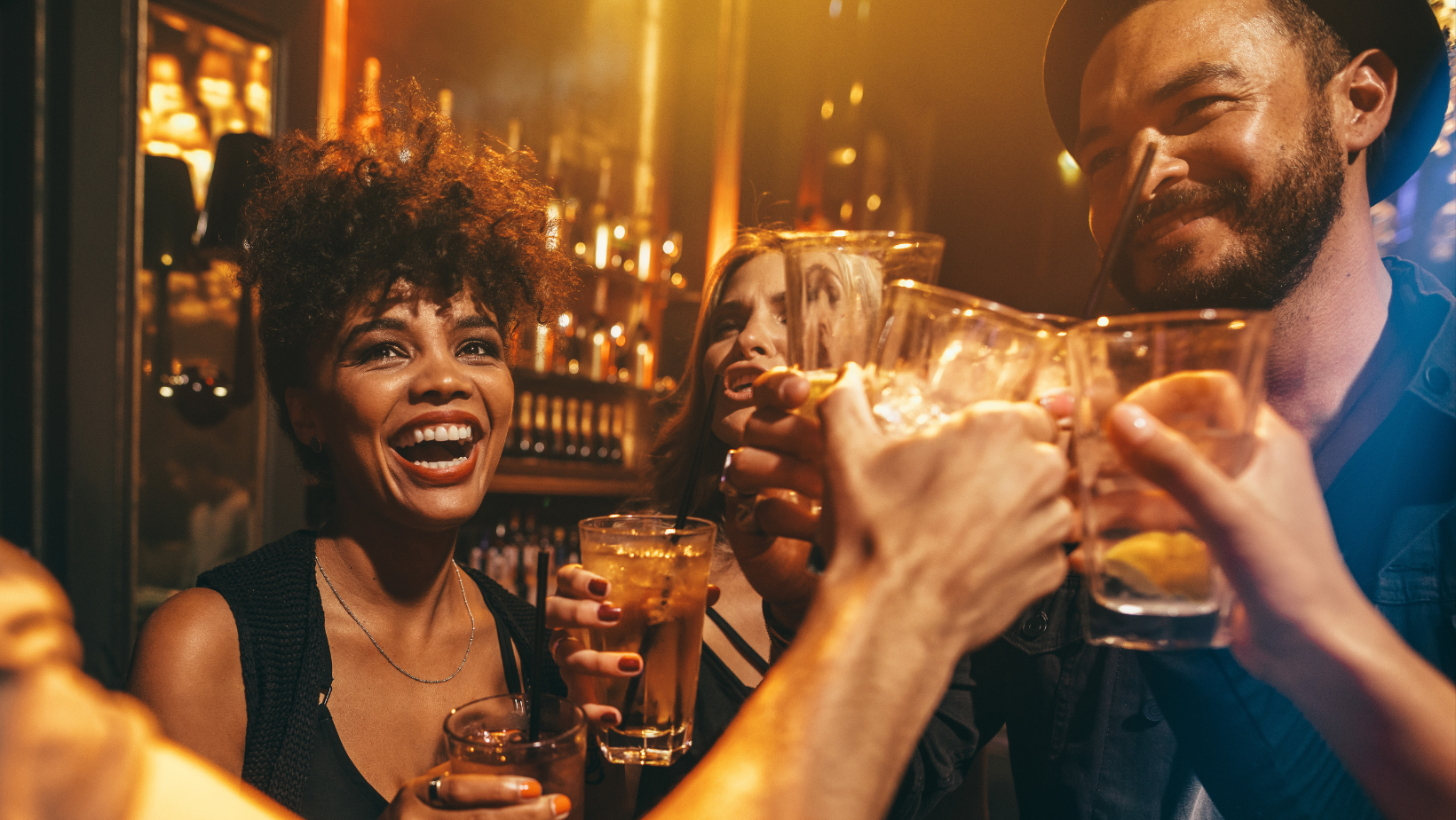 men and women sharing a toast