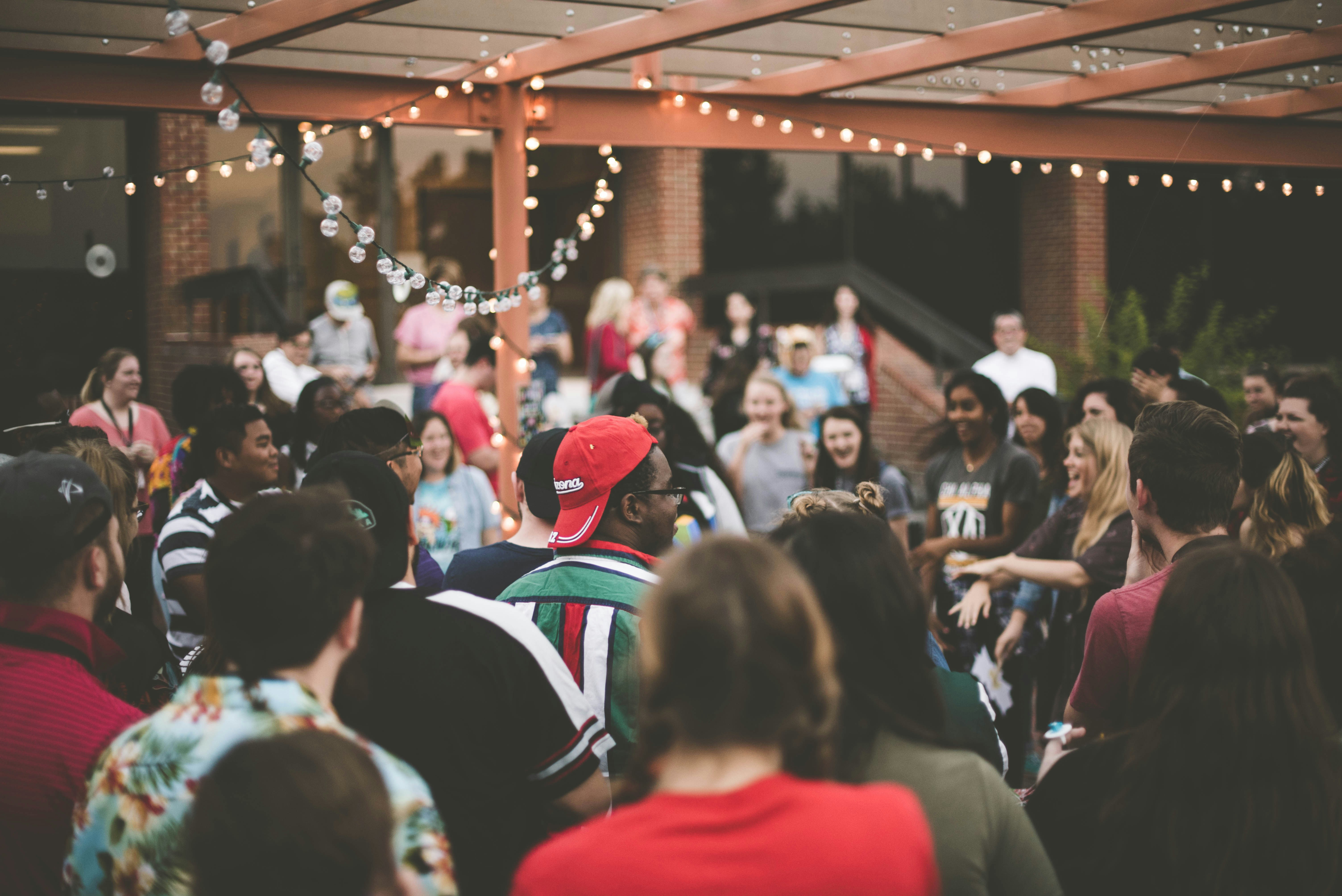 a group of people standing in front of a crowd