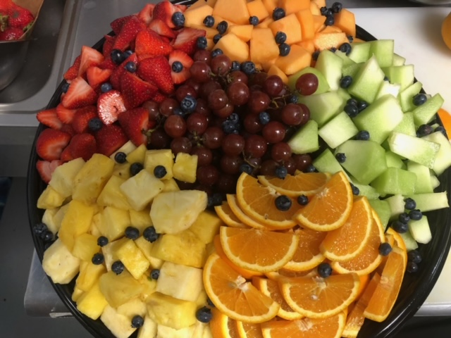 a bowl of oranges on a table