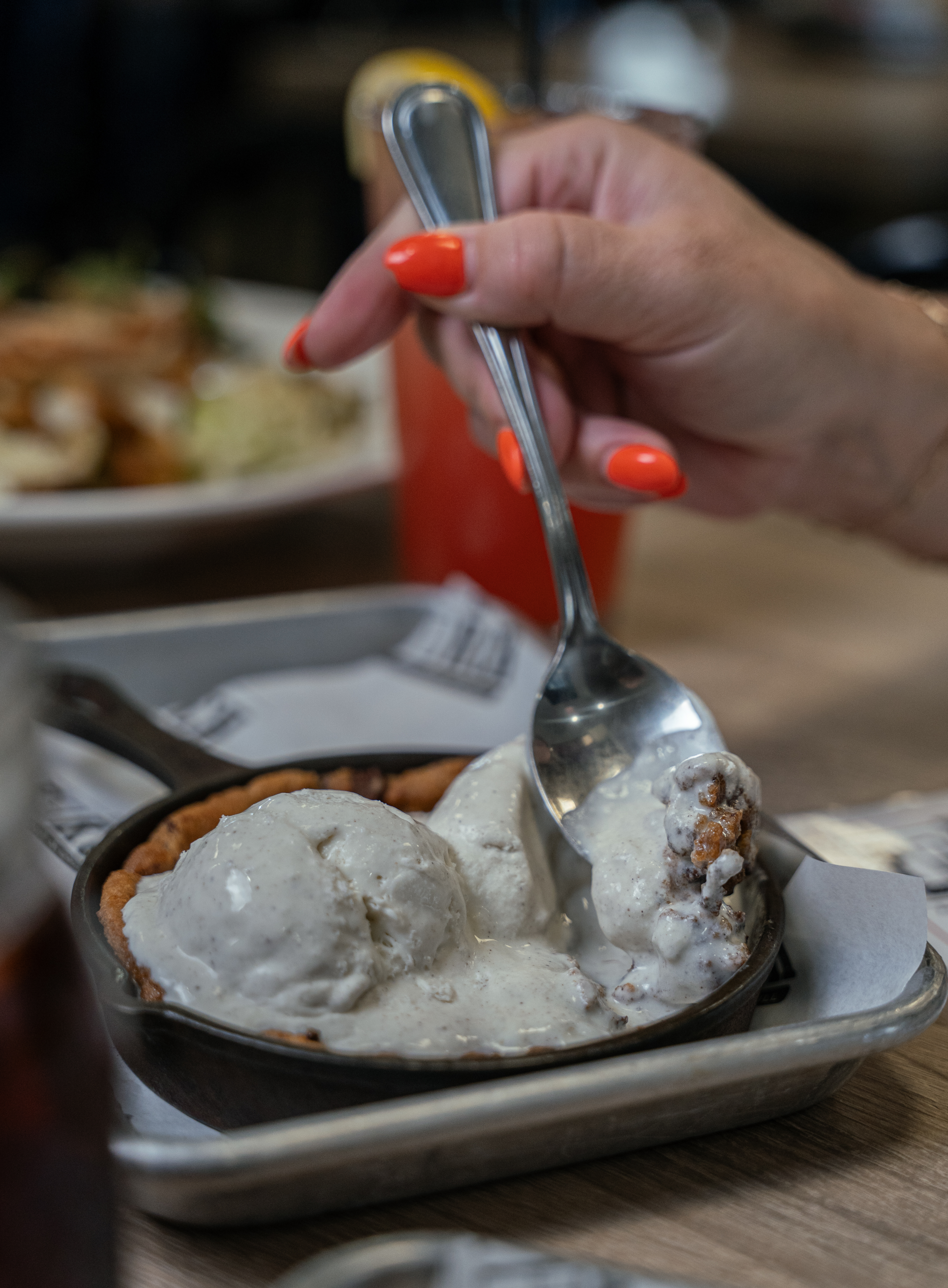 a close up of a person holding a plate of food