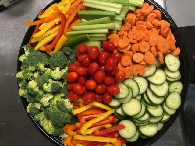 a box filled with different types of vegetables