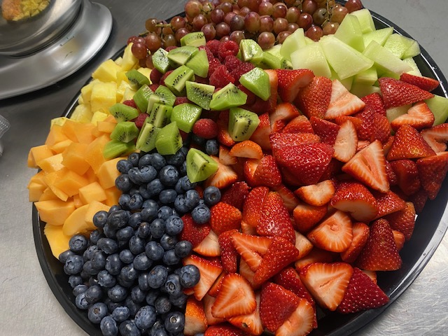 a bowl of fruit on a plate