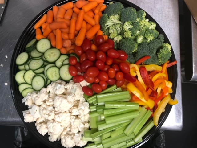 a box filled with different types of vegetables