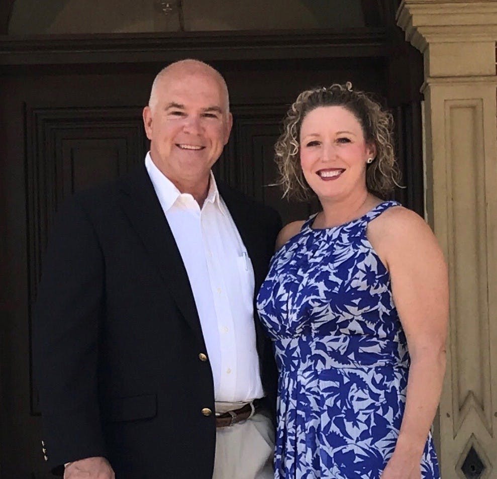 a man and a woman posing for a photo