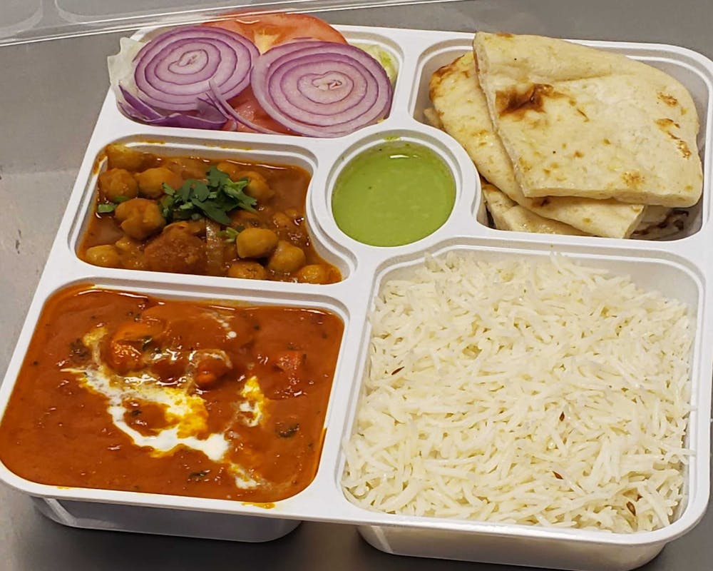 a box filled with different types of food on a tray