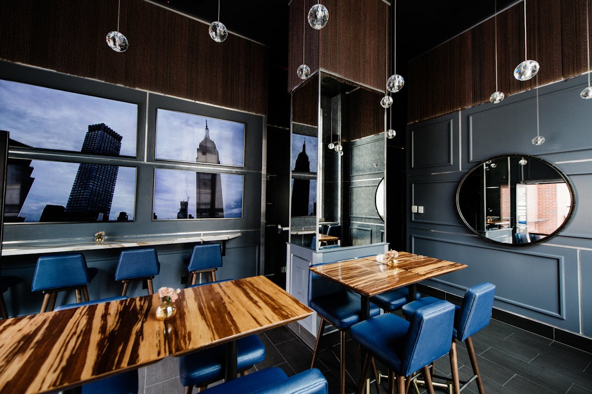 a kitchen with a blue chair