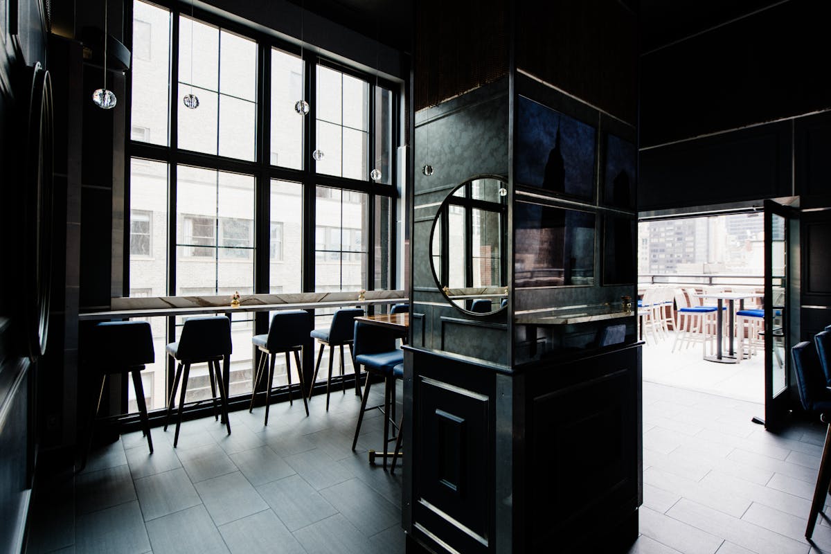 a room filled with furniture and a large window